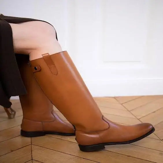 Man wearing brown leather riding boots