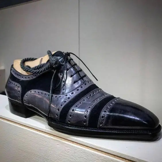 Black captoe oxford shoes showing sole construction