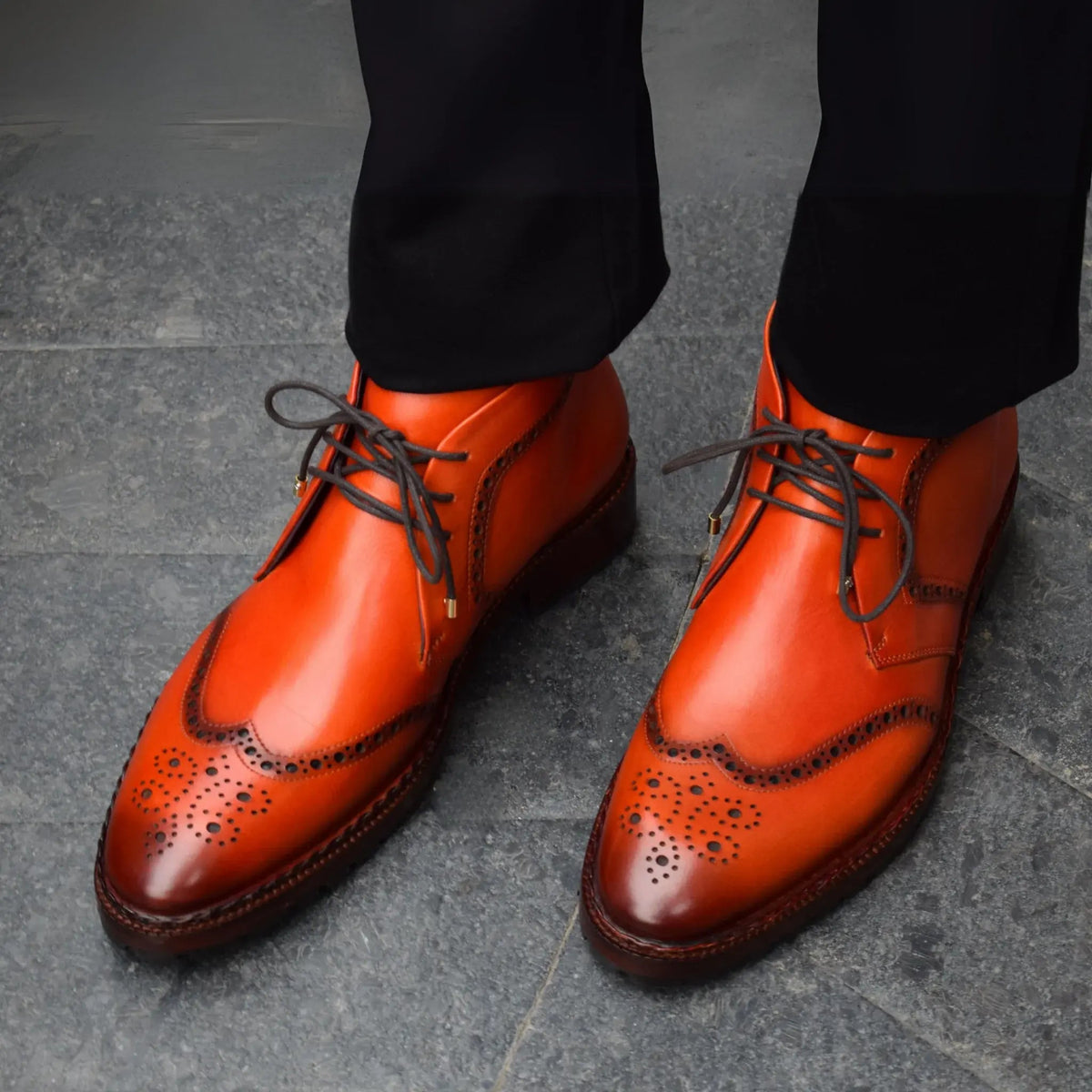 Suede chukka boots worn with tailored trousers